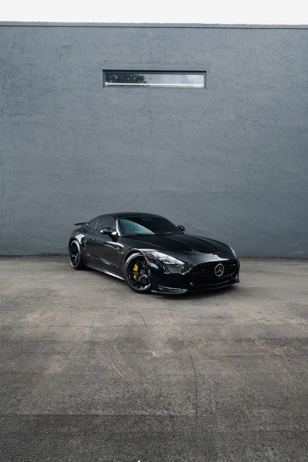 Blacked-out Mercedes-AMG SL on Miami concrete