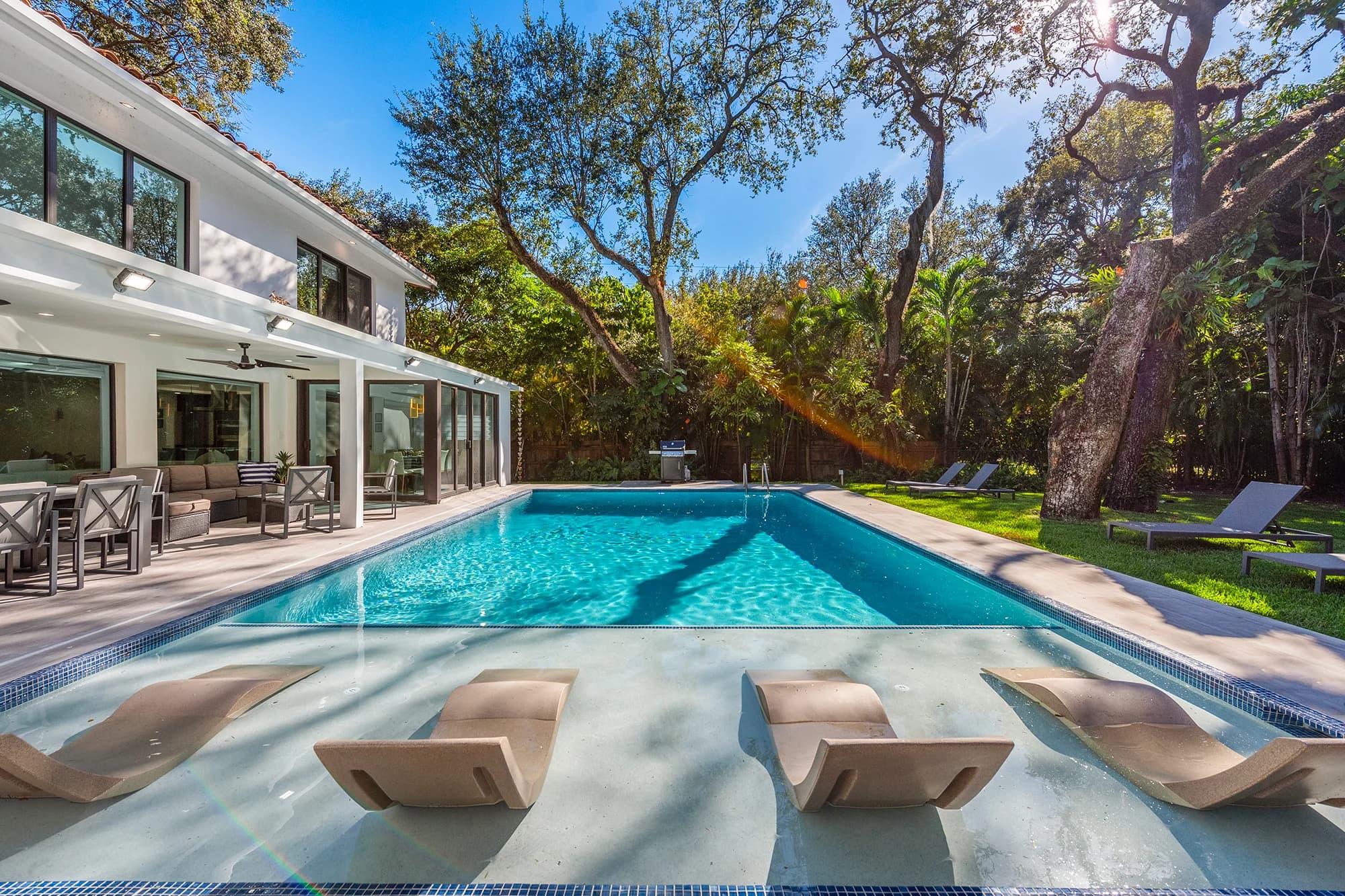 Pool and outdoor seating at Villa Arielle