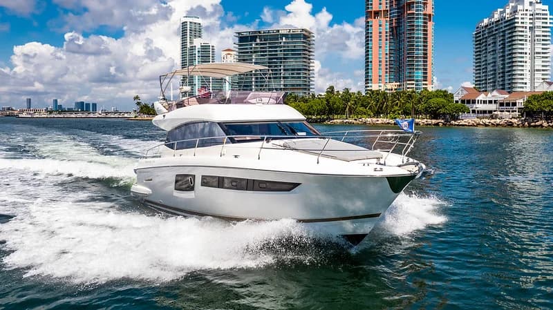 52 Prestige underway with its flybridge and bow seating visible