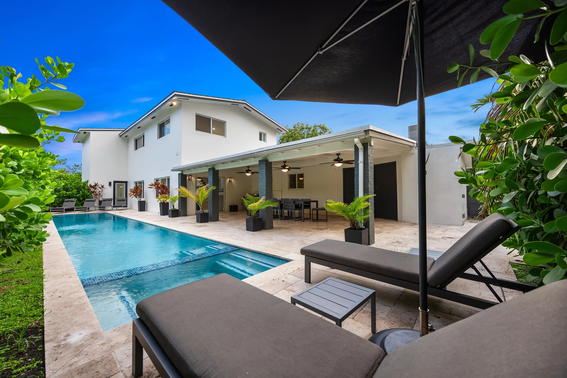 Pool terrace and covered seating at Casa Everly