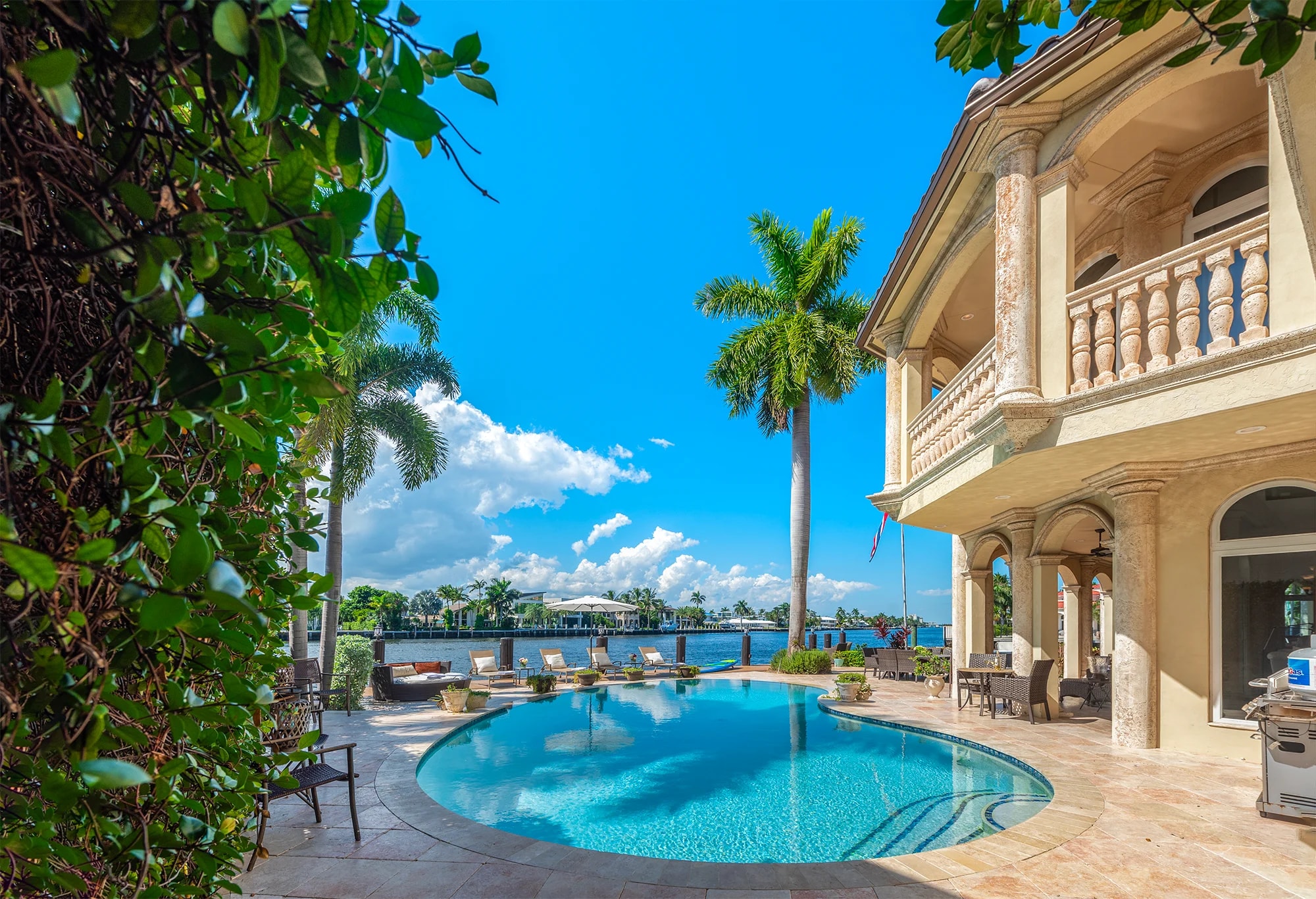 Pool and waterfront terrace at Villa Delfine