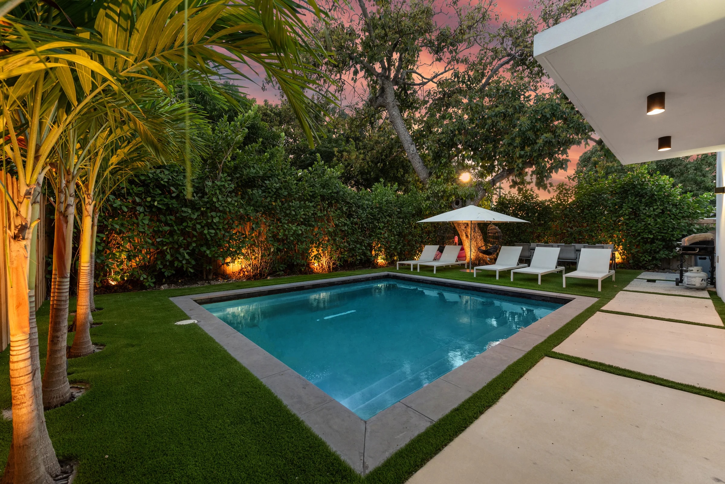 Pool and landscaped yard at Villa Milano