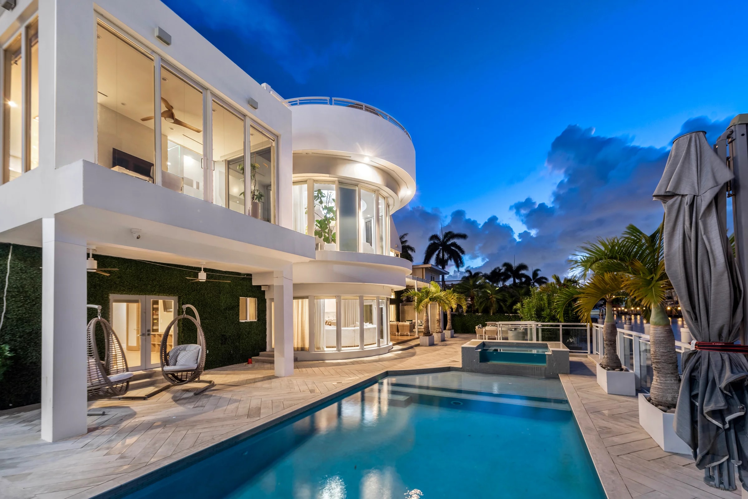 Pool terrace and waterfront exterior at Villa Seminole